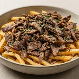 Fries topped with beef shawarma