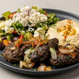 Grilled kafta platter with hummus and vegetables