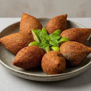 Fried kibbeh stuffed with seasoned ground beef