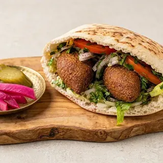 Kibbeh sandwich in pita with pickles